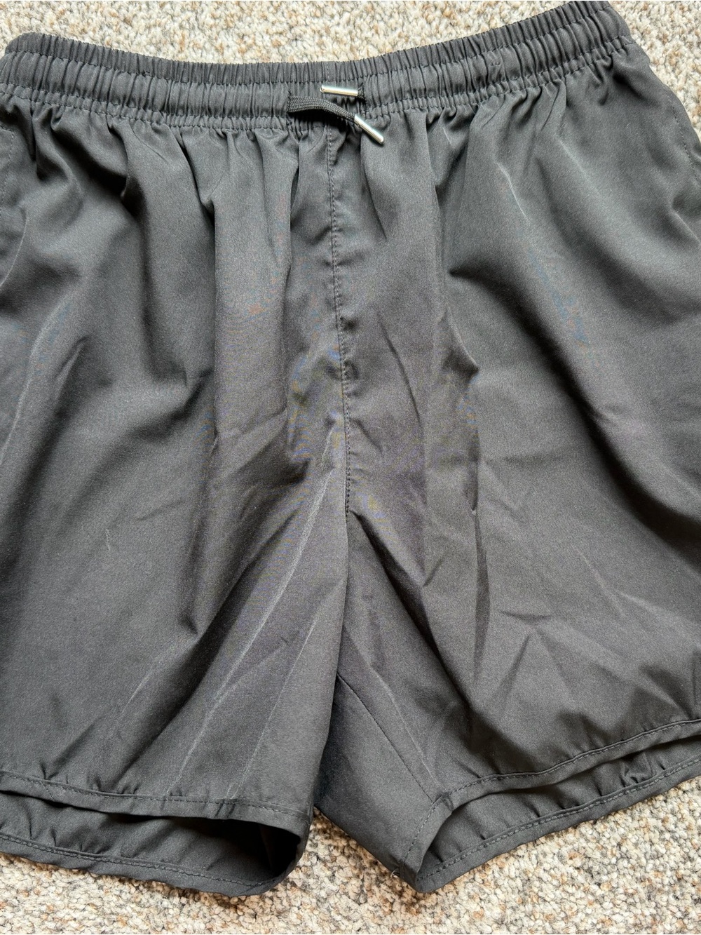 Athletic shorts women’s size medium. Black nylon material. Never worn. EUC